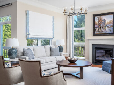 Frame tv, walnut console, circular table, beige chair, modern light, fire place, custom window treatments