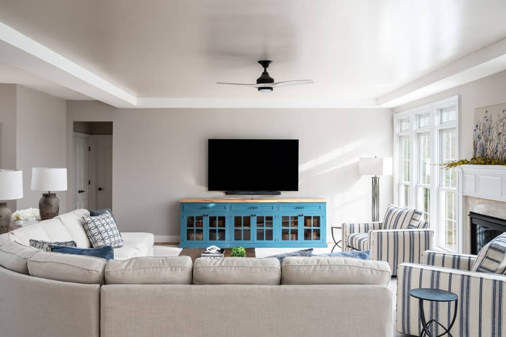 Living room with bright blue console and large tv