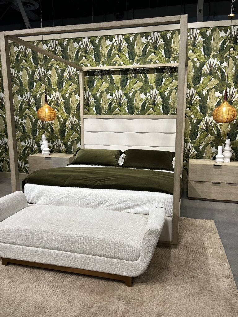 Wavy modern style poster bed headboard seen at the Spring 2023 High Point Market in North Carolina