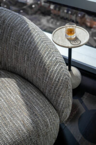 Modern swivel chair with drink table