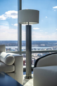 marble lamp with white upholstered chair trimed in black oak