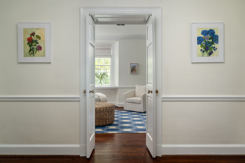 A view from a hallway look into a cozy den