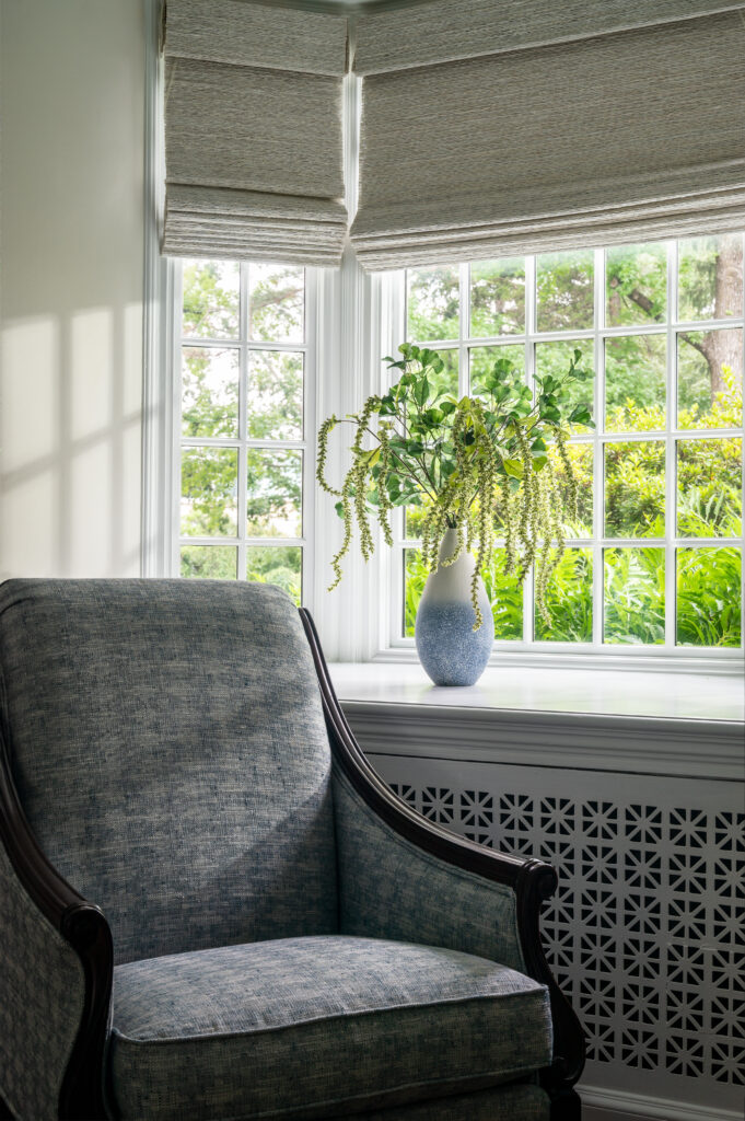 soft lighting streaming onto a custom upholstered chair