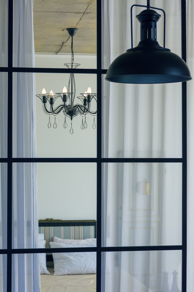 Black Pendant Lamp Near Glass Panels