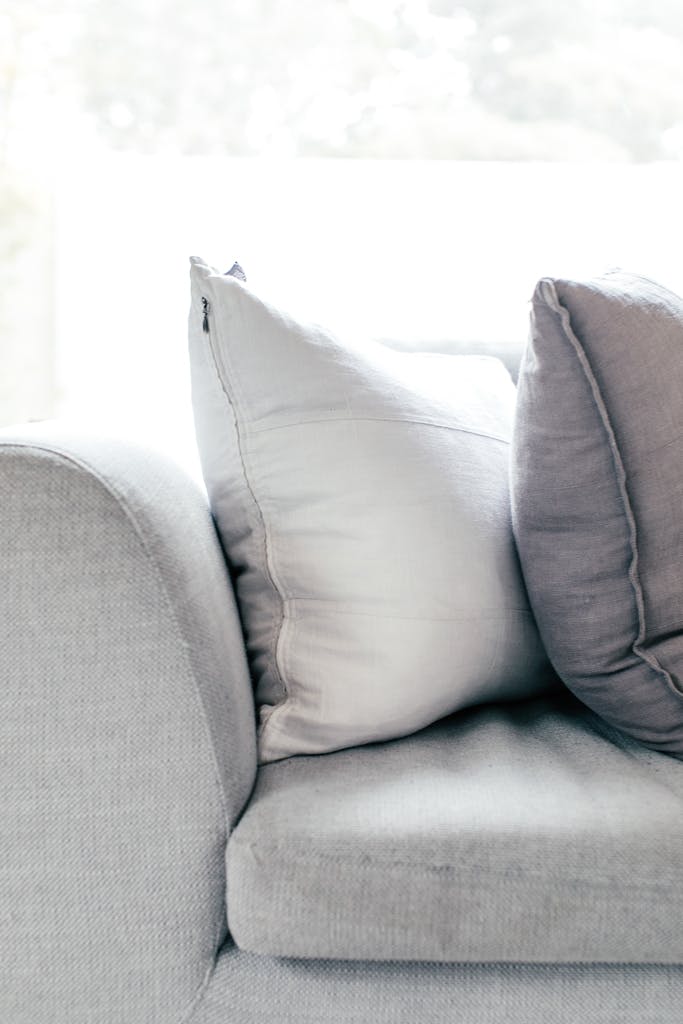 Cushions on sofa in living room in daytime