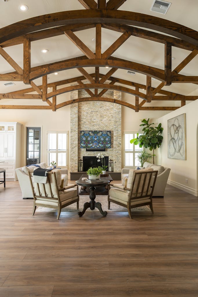 Cozy and luxurious living room featuring elegant wooden beams and stylish furniture.