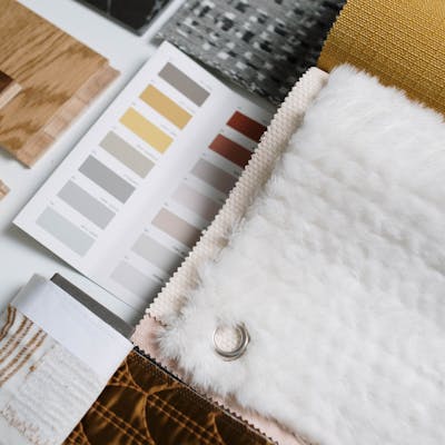A flat lay of color swatches and fabric samples ideal for interior design inspiration.